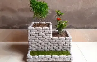 مراحل ساخت یک گلدان زیبا با سیمان و سنگ ریزه + ویدئو