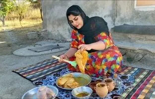 (ویدئو) روش شگفت انگیز دختر روستایی کردستانی برای پختن مرغ روی سنگ