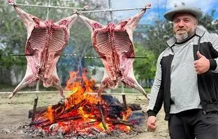 (ویدئو) کباب کردن تماشایی بره 13 کیلوگرمی روی ذغال توسط آشپز روستایی روسی