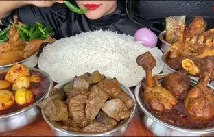 (ویدئو) خوردن 4.5 کیلوگرم چلو مرغ، جگر، گوشت، ماهی و بلدرچین توسط دختر هندی