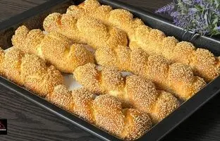 (ویدئو) طرز تهیه نان شیری کنجدی؛ یک میان وعده نرم و خوشمزه