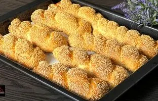 (ویدئو) طرز تهیه نان شیری کنجدی؛ یک میان وعده نرم و خوشمزه