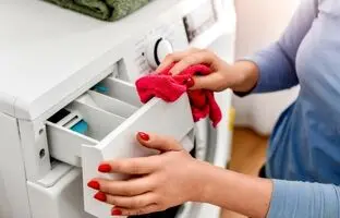 چگونه مخزن جاپودری ماشین لباسشویی را تمیز کنیم؟