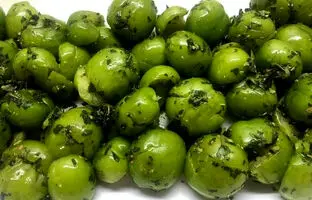خوشمزه بپزید؛ طرز تهیه هلی کتنی (گوجه سبز کوبیده) به روش اصیل شمالی
