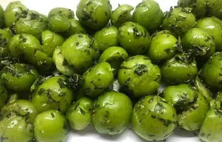 خوشمزه بپزید؛ طرز تهیه هلی کتنی (گوجه سبز کوبیده) به روش اصیل شمالی