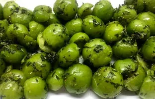 خوشمزه بپزید؛ طرز تهیه هلی کتنی (گوجه سبز کوبیده) به روش اصیل شمالی