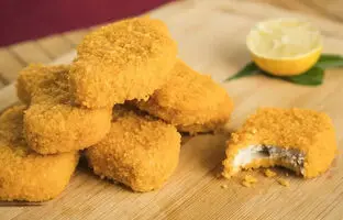 طرز تهیه ناگت خانگی با طعمی بهتر از فست‌فود‌ها + ویدئو