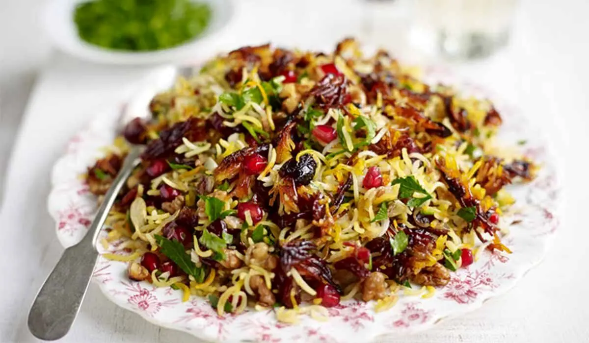 آشنایی با روش تهیه انار پلو با پرک بادام+ فوت و فن